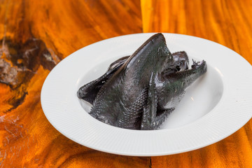 black chicken in bowl