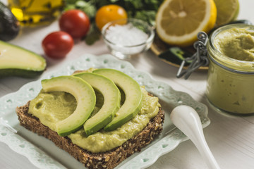 Fresh Avocado Spread Guacamole as Healthy Breakfast on White Background