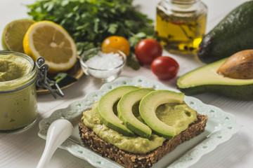 Fresh Avocado Spread Guacamole as Healthy Breakfast on White Background