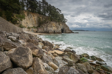 Fototapeta na wymiar Beach with rocks on it in Brittany in Northern France