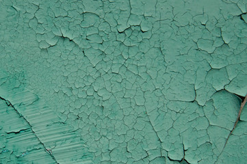 Background old wall emerald, green with cracks.