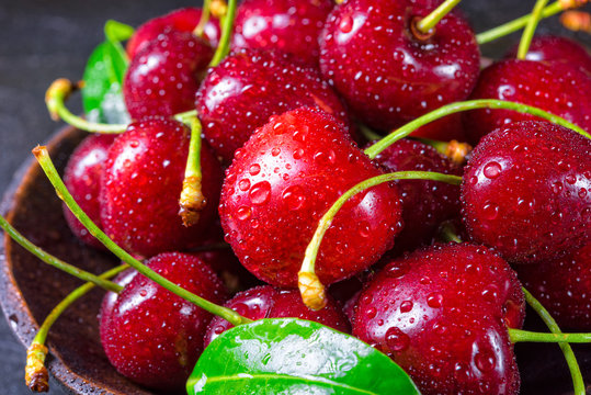 freshly picked cherry in a wooden bowl