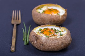 Baked potatoes stuffed with cheese and egg