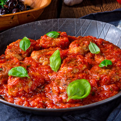 Rustic mini meatballs  Baked  in tomato sauce with basil