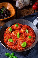 Rustic mini meatballs  Baked  in tomato sauce with basil