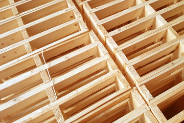 New wooden pallets is stack in the warehouse of cargo delivery enterprise.