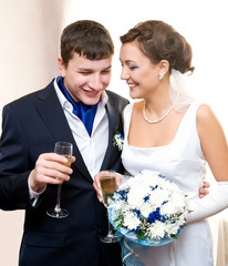 bridegroom and bride with champagne