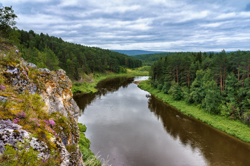 Fototapeta na wymiar Summer landscape from the rock on the Ufa river in the Ural mountains. nature of Russia.