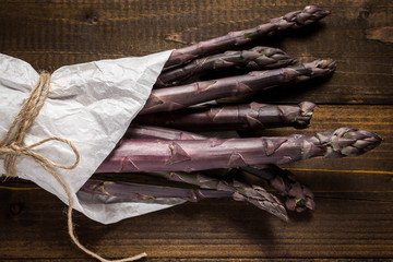 Purple Asparagus Wrapped in White Paper