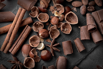 Chocolate curls and hazelnuts on slate plate