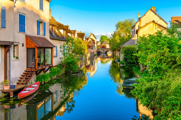 Eure River embankment with old houses in a small town Chartres, France