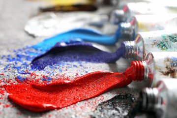 Tubes with oil paints on table, closeup