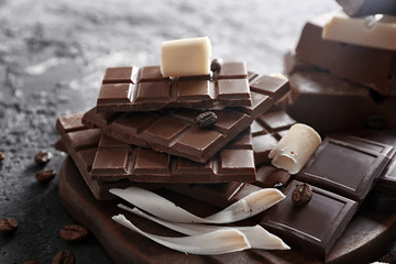 Chocolate pieces on wooden board