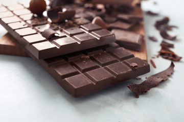 Dark chocolate bars on table