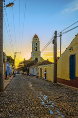 Fototapeta na wymiar sunset behind the church tower in trinidad, cuba
