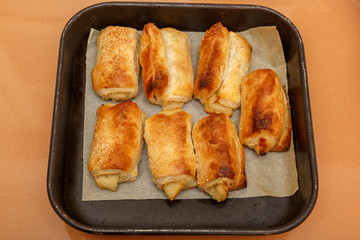 Seven bourekas on square pan