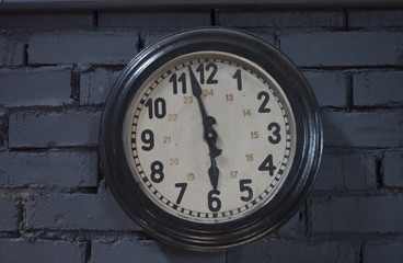 Clocks Antique vintage retro styles hanging on the brick wall , with copy space for text.