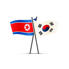 South and North Korea flags on poles on white