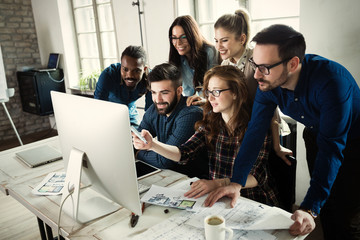 Young architects working on project in office