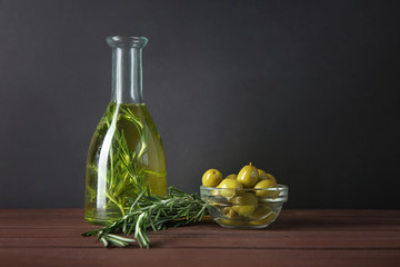 Bottle with olive oil on table