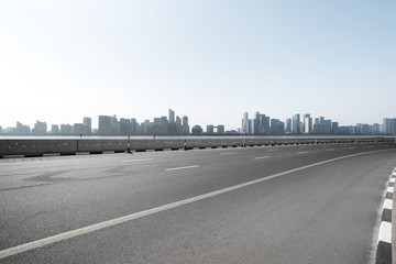 empty road with city skyline