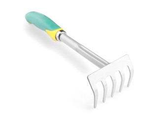 Metal rake for gardening on white background