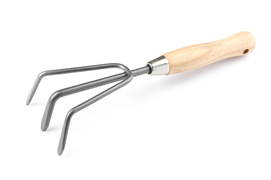 Metal rake for gardening on white background