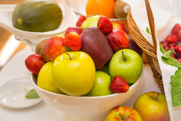 Decoration with ripe delicious fruits on white table