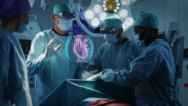 Surgeons Wearing Augmented Reality Glasses Perform Heart Surgery with Help of Animated 3D Heart Model. Doing Difficult Heart Transplant Operation Using Gestures.  Shot on RED EPIC-W 8K.