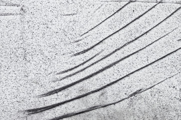Grunge white felt texture background with black dust spraying, wrinkles and torn edges. Dirty damaged style, worn surface for design or web projects. Space for text. 