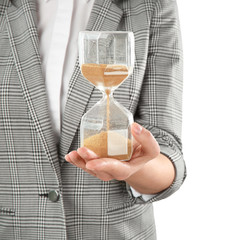 Woman holding hourglass on white background. Time management concept