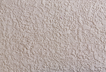 Beige rough wall textured background. Abstact stucco. Texture of plaster on the wall.