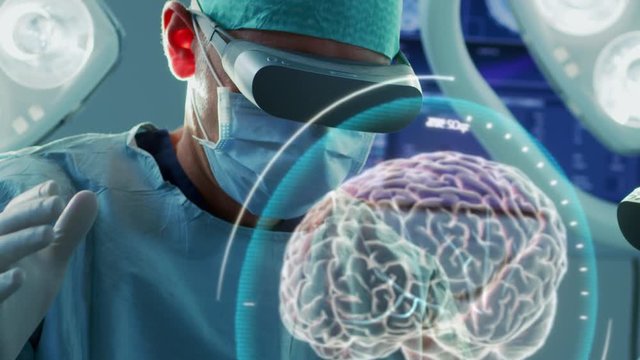 Surgeon Wearing Augmented Reality Glasses Perform Brain Surgery with Help of Animated 3D Brain Model, Using Gestures. Futuristic Theme. Close-up Shot. Shot on RED EPIC-W 8K Helium Cinema Camera.