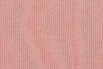 Pale pink seamless ribbed fabric. Close up texture