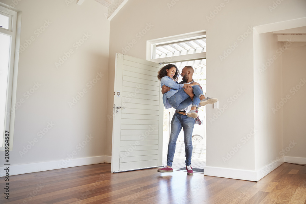 Sticker Man Carrying Woman Over Threshold Of Doorway In New Home