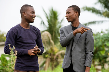 business people speaking together outdoors