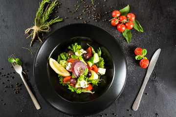 Fresh tasty salad dish with vegetables and herbs
