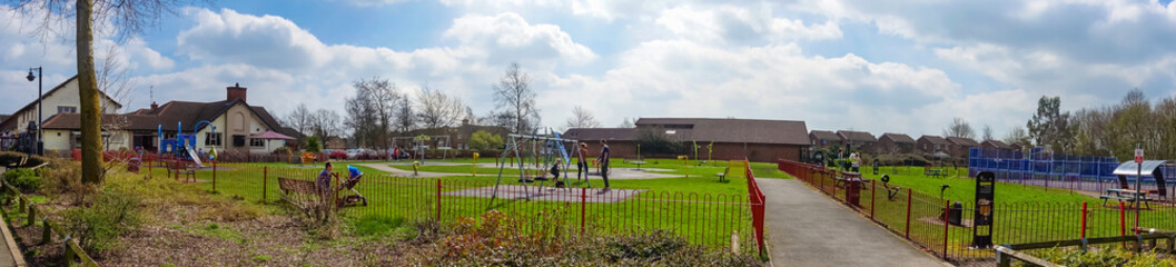 A panoramic view of a village playground.