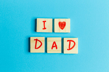  alphabet on small plate on Blue background  for Father ’s day image .