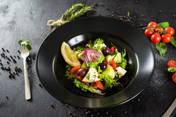 Fresh tasty salad dish with vegetables and herbs
