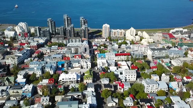 Reykjavik down town streets. oceanfront embankment and port. Aerial drone video footage flight. View from the top