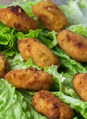 ham croquettes and cooked with vegetables in the background