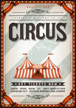 Vintage Design Circus Poster/
Illustration of an old-fashioned vintage circus poster, with big top, design elements and grunge textured background