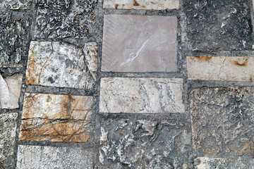 old marble stone pavement in corfu town. background
