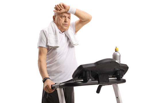 Exhausted senior on a treadmill