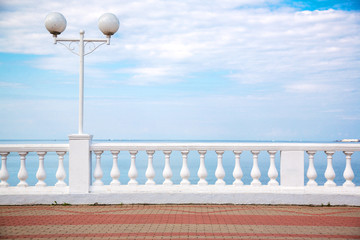 beautiful promenade with parapet overlooking the blue sky with clouds