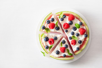 Naklejka na ściany i meble watermelon pizza slices with yogurt and berries, summer dessert