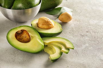 Fresh sliced avocado on table