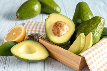 Fresh ripe avocados on table