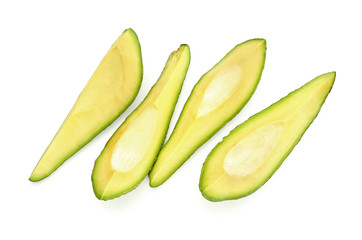 Pieces of ripe avocado on white background